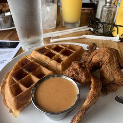 Freddie G's Chicken And Waffle - This is my meal half a chicken and waffle with three wings There is a special wing sauce made by the owner