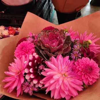 Pike Place Market - One of these flowers is made out of cabbage can you guess what one? - Public Markets Near Me - Seattle, Washington