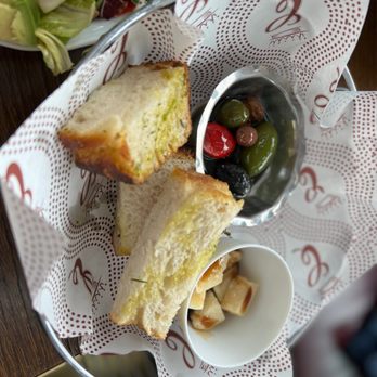 Contessa - Boston - Bread and olives with chunks of parmigiana cheese - Italian Near Me - Boston, Massachusetts