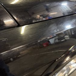 Scratch marks after the guy used a dirty broom to put shampoo on my car