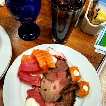 Cafe Sierra - Assorted Sashimi, Sushi, Prime Rib and Lamb. Drinks: Iced Water and Diet Coke. The Lamb tasted a bit dried this year. - New American Near Me - Universal City, California