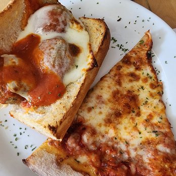 Sal's Italian Restaurant - two slices of pizza on a plate - Italian Near Me - Miramar, Florida Sal's Italian Restaurant - two slices of pizza on a plate - Italian Near Me - Miramar, Florida