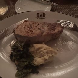 Pork chop, mashed potatoes, and collard greens