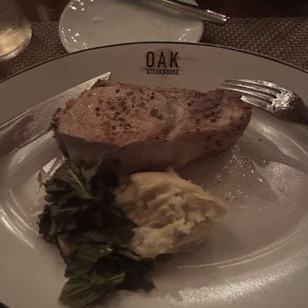 Oak Steakhouse - Pork chop, mashed potatoes, and collard greens - Steakhouses Near Me - Raleigh, North Carolina