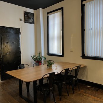 Engine Coffee - a table with chairs and a exit sign - Coffee & Tea Near Me - Chicago, Illinois Engine Coffee - a table with chairs and a exit sign - Coffee & Tea Near Me - Chicago, Illinois