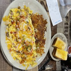 R & K Cafe - The Ultimate Omelette with crispy hash browns and toast.