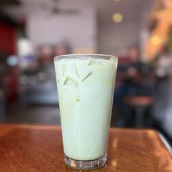 Café Eclectic - An Iced matcha latte sweetened with blueberry syrup and lavender.