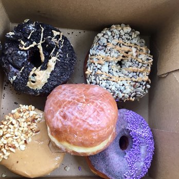 Voodoo Doughnut - Just pretty looking donuts. The grape was awful - Bakeries Near Me - Orlando, Florida Voodoo Doughnut - Just pretty looking donuts. The grape was awful - Bakeries Near Me - Orlando, Florida