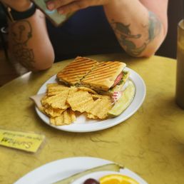 A chicken sandwich and chips
