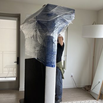 Aisa Moving - Wrapping the couch. - Movers Near Me