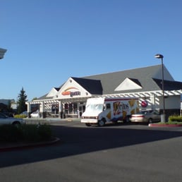 a food truck parked in front of a restaurant