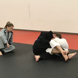 Nicole Hunt , Brown belt and instructor, supervises two of our lady students.