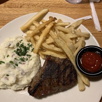 Applebee's Grill + Bar - Swelling with garlic potatoes and fries. Steak was so juicy and cooked perfectly! - American Near Me - Marshall, Texas Applebee's Grill + Bar - Swelling with garlic potatoes and fries. Steak was so juicy and cooked perfectly! - American Near Me - Marshall, Texas