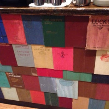 Elements - Awesome bar front made out of hardcovers. - Bars Near Me - Biddeford, Maine