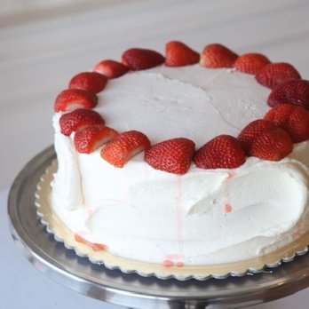 The Cakeroom - Website picture of cake. Website description read cake is full go strawberries. - Cupcakes Near Me - Washington, DC, District of Columbia