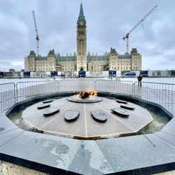 Parliament of Canada - Centennial flame in front of Parliament building and Peace tower