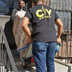 CV Moving - Your crew in the middle of a tricky appliance delivery, with narrow stairs! Delivered without a hitch!