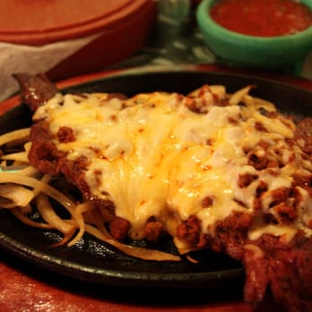 La Brisa Mexican Bar & Grill - Carne Flameada: Beef skirt steak topped with chorizo, grilled onions and cheese - Mexican Near Me - Bacliff, Texas