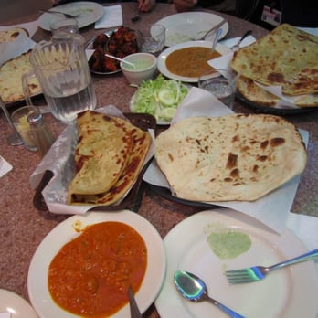 Khan BBQ - Chicken Tikki Masala (bottom left), Paratha and Naan, Palak Gosht, goat curry (upper right) and Tandoori Chicken (upper left) - Barbeque Near Me - Chicago, Illinois
