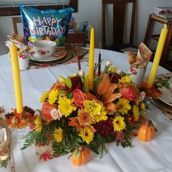 Albert's Florals & Gifts - This fall arrangement comes with one candle. The other candles came with arrangements that were delivered the last 2 years.