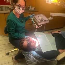 Indian Hills Dental Office - Dr. Angela giving Matthew is annual cleaning. Thank you Indian Hills Dental for all that you do for us.