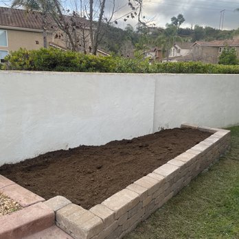 Coronado Turf - Nice plantation built using stone blocks. - Artificial Turf Near Me