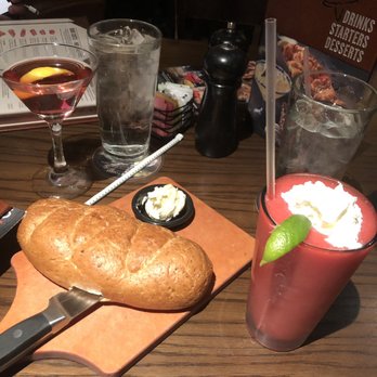 LongHorn Steakhouse - Cosmopolitan adult beverage fresh baked bread and creamy buttery spread and strawberry daiquiris with icy cold waters. - Steakhouses Near Me - Williston, Vermont