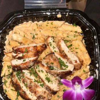 The Flava Zone - a plate of chicken and pasta - Chicken Wings Near Me - Lauderhill, Florida