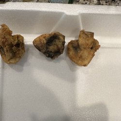 Harris County Smokehouse - This is a close up picture of a mushroom cut in half then in half.
