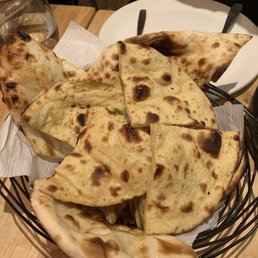 Buttery bread basket - assortment of naan, khulcha, paratha, roti