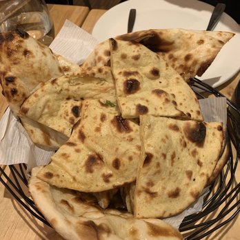 Cumin Kitchen - Fine Indian Cuisine - Buttery bread basket - assortment of naan, khulcha, paratha, roti - Indian Near Me - Toronto, Ontario