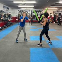 Clearwater Boxing Center - My son getting a quick lesson with Coach Cherry after our fitness class.