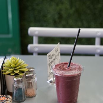 Green Nectar Juicery - a smoothie on a table - Juice Bars & Smoothies Near Me - Millburn, New Jersey