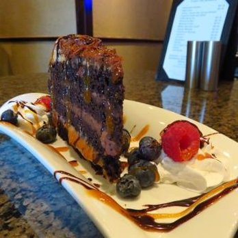Freighters Lounge - a slice of chocolate cake on a plate - Lounges Near Me - Sarnia, Ontario Freighters Lounge - a slice of chocolate cake on a plate - Lounges Near Me - Sarnia, Ontario