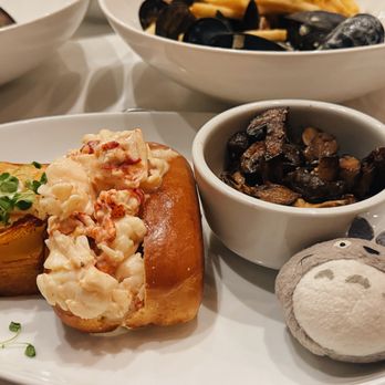 Peche Modern Coastal - Lobster roll potato and mushroom side dish. The roll is overwhelmed with  mayonnaise. - Seafood Near Me - Peachtree Corners, Georgia