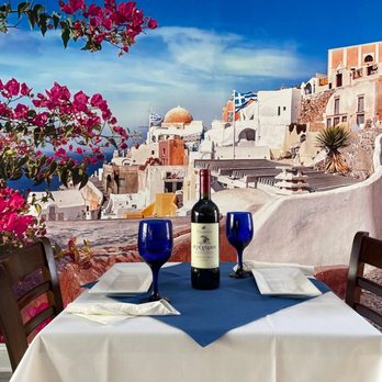 Zorba's Grill - a table with a bottle of wine - Mediterranean Near Me - Occoquan, Virginia