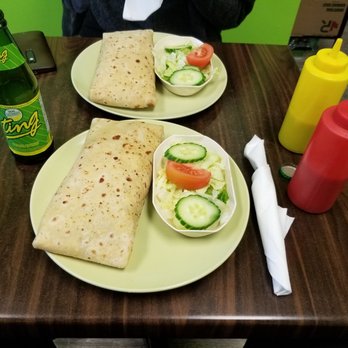 Pam's Roti Shop - two plates of food on a table - Caribbean Near Me - Toronto, Ontario Pam's Roti Shop - two plates of food on a table - Caribbean Near Me - Toronto, Ontario