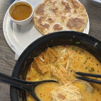 Borneo Eatery - Laksa with vermicelli noods, roti in the background - Indonesian Near Me - Alhambra, California Borneo Eatery - Laksa with vermicelli noods, roti in the background - Indonesian Near Me - Alhambra, California
