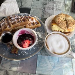 Belgian Waffle, Breakfast Bagel Sandwich, cappuccino Belgian Waffle, Breakfast Bagel Sandwich, cappuccino