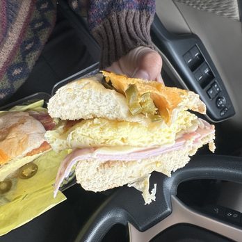 Mr. Blue's Donuts - a person holding a sandwich - Donuts Near Me - Riverside, California
