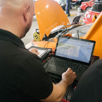 Prestige Auto Tech - Our certified techs running diadnostics - Auto Repair Near Me - Miami, Florida
