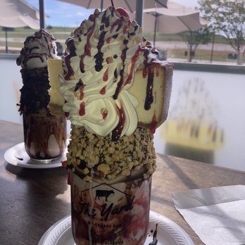 The Yard Milkshake Bar - Brownie and original banana split with cheesecake milkshake - Ice Cream & Frozen Yogurt Near Me - Madison, Alabama