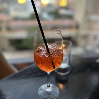 Scarpetta - a drink in a glass with a straw - Italian Near Me - Las Vegas, Nevada