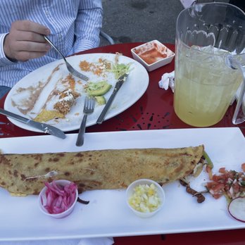 Señor Machetes - Fajita Machete, (flautas remnants in the back), pitcher of margs - Mexican Near Me - Madison, Wisconsin