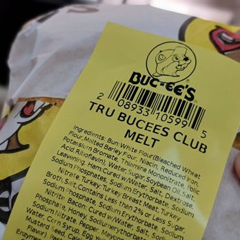 Buc-ee's - a hand holding a bag of burgers - Gas Stations Near Me - Madisonville, Texas Buc-ee's - a hand holding a bag of burgers - Gas Stations Near Me - Madisonville, Texas