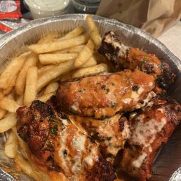 Butter chicken wings and fries