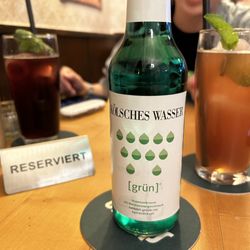 Bei Oma Kleinmann - Left to right: blackcurrent spritzer, Kölsches Wasser [grün] - traditional German Waldmeister (woodruff) flavored soda, and rhubarb spritzer