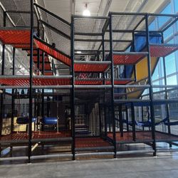 The Center at Northview - Climbing area which is surrounded by benches for parents to sit and is gated.