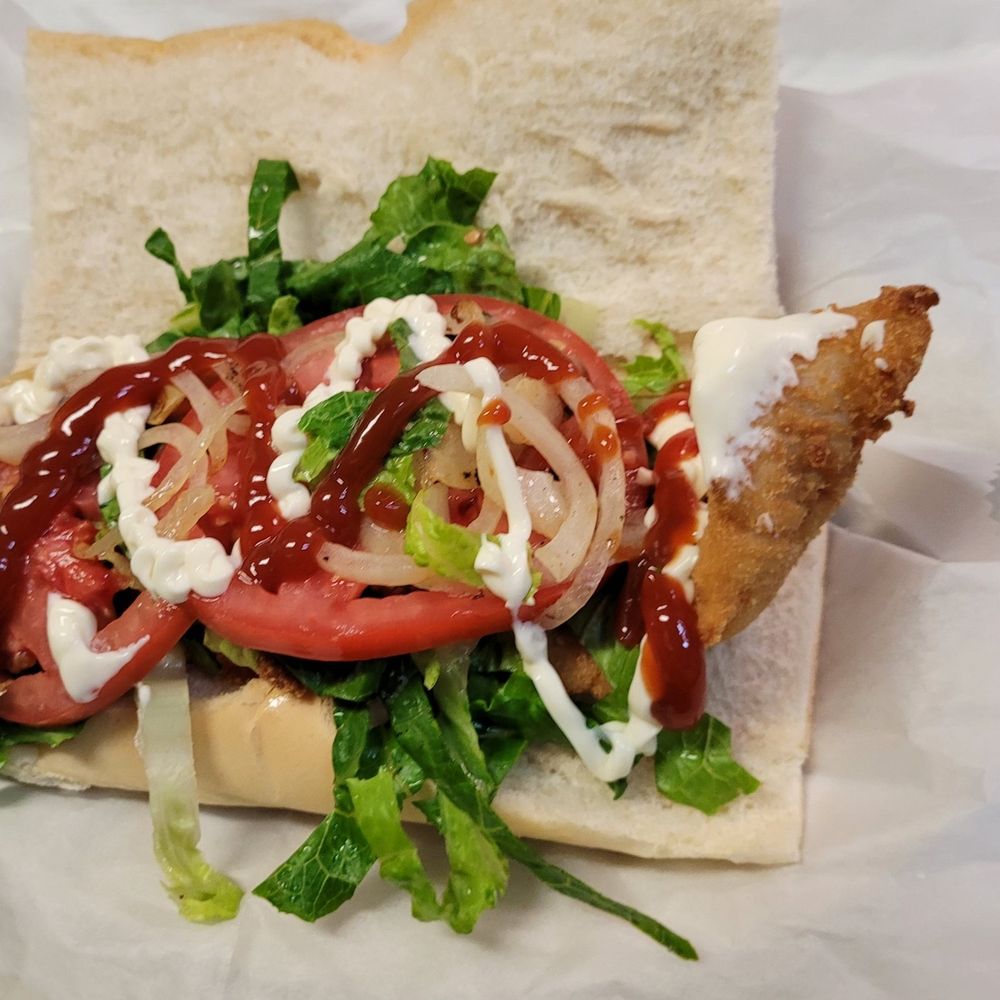 Cubachobee - a hot dog with onions, tomatoes, and lettuce - Cuban Near Me - Medley, Florida
