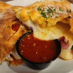 Colonna's Pizza - All meat calzone with warm marinara sauce